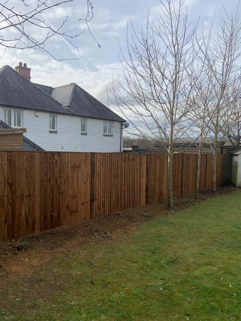 This is a photo of feather edge fencing installed in a residential properties garden by Fast Fix Fencing Paddock Wood