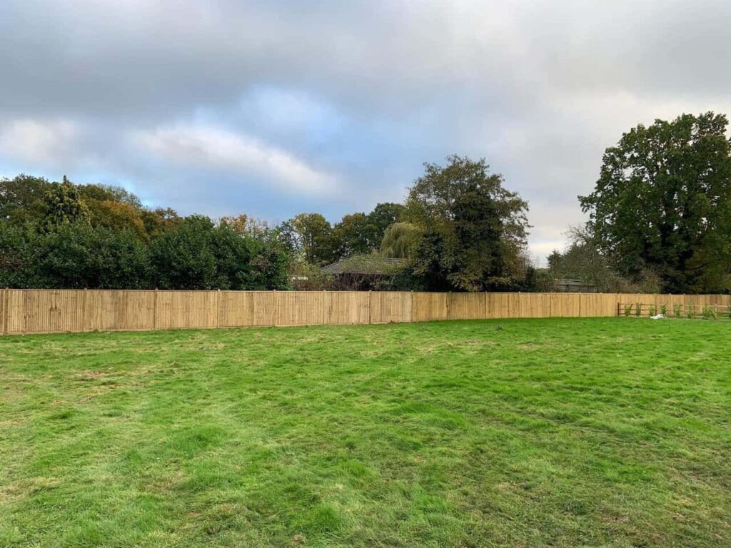 This is a photo of feather edge fencing installed around the edge of a field by Fast Fix Fencing Paddock Wood