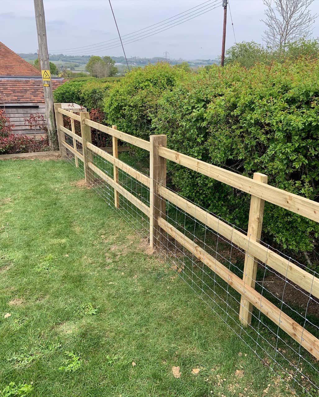 This is a photo of a post and rail fence installed in a field by Fast Fix Fencing Paddock Wood